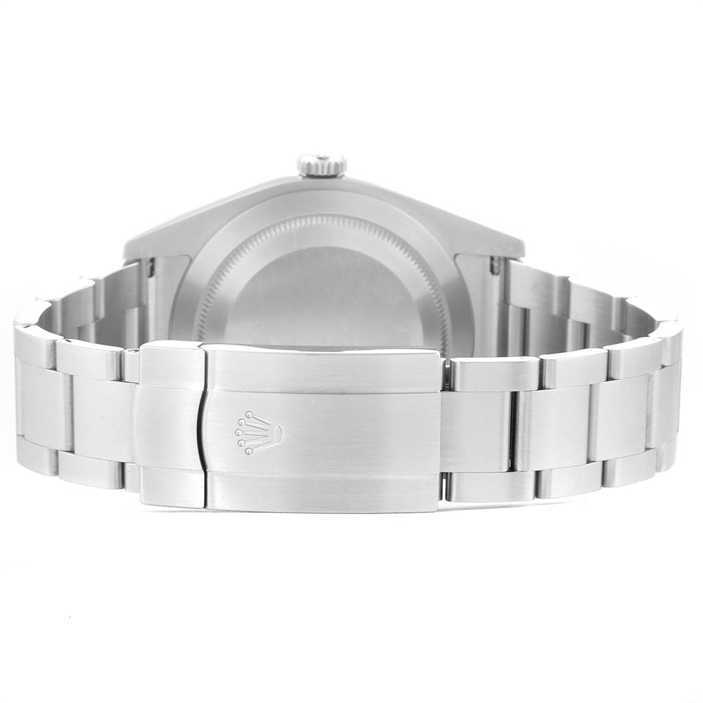 The image shows the back case and bracelet clasp of a Rolex Oyster Perpetual 114300 Men's Stainless Steel Blue Dial 114300 Men's Stainless Steel Blue Dial watch.