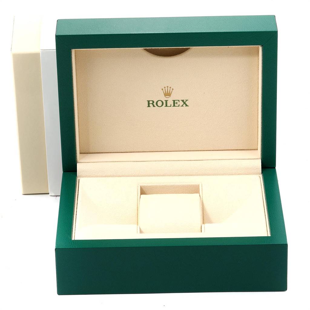 The image shows an open green Rolex watch box intended for the Oyster Perpetual model, featuring a beige interior.
