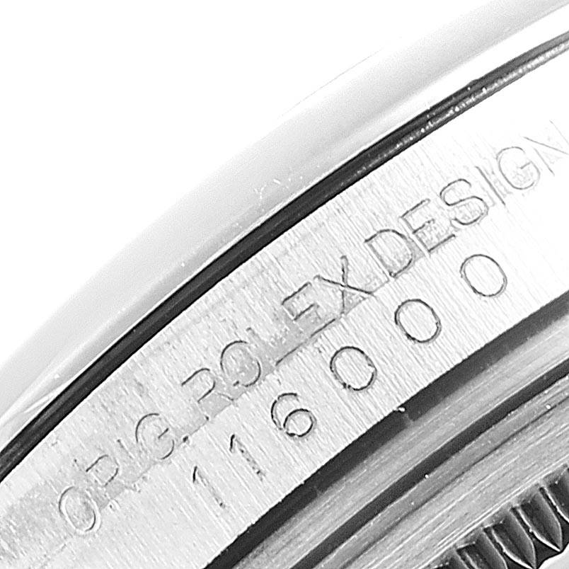 The image shows a close-up angle of the side engraving on a Rolex Oyster Perpetual 116000 Men's Stainless Steel Grey Dial 116000 Men's Stainless Steel Grey Dial watch, displaying the model number "116000".