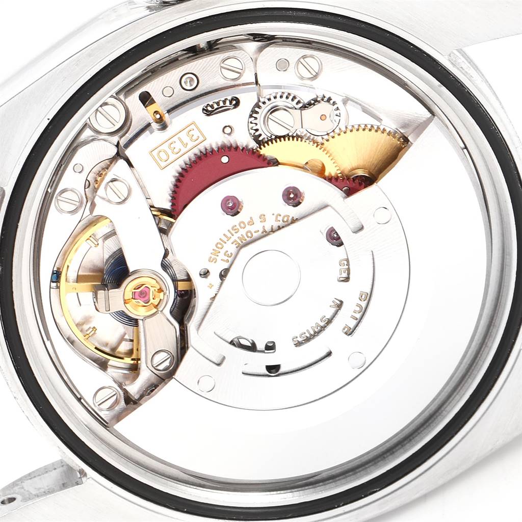This image shows an internal view of the movement mechanism of a Rolex Oyster Perpetual 116000 Men's Stainless Steel Grey Dial 116000 Men's Stainless Steel Grey Dial watch.