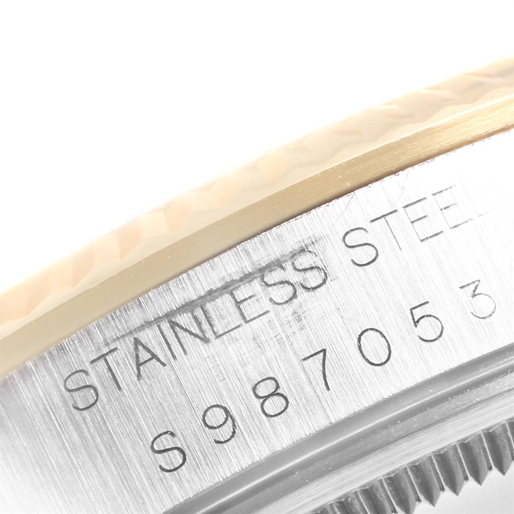 The image shows a close-up of the stainless steel case with serial number engraving on a Rolex Oyster Perpetual 14233 Men's Steel and Gold (two tone) Grey Dial 14233 Men's Steel and Gold (two tone) Grey Dial watch.