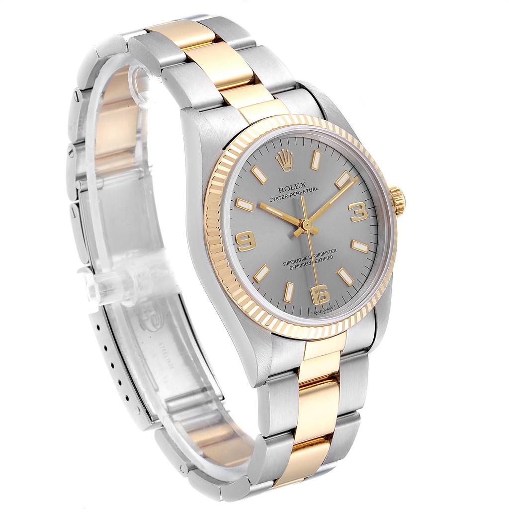 The Rolex Oyster Perpetual 14233 Men's Steel and Gold (two tone) Grey Dial 14233 Men's Steel and Gold (two tone) Grey Dial watch is shown from a three-quarter angle, highlighting its face, bezel, and two-tone bracelet.