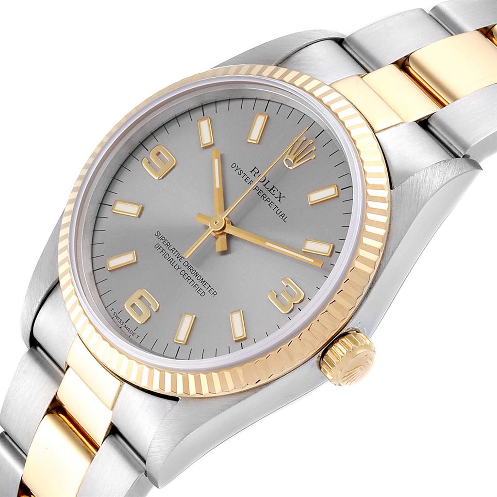The image shows a close-up of a Rolex Oyster Perpetual 14233 Men's Steel and Gold (two tone) Grey Dial 14233 Men's Steel and Gold (two tone) Grey Dial watch at an angle that highlights the face, bezel, and part of the bracelet.