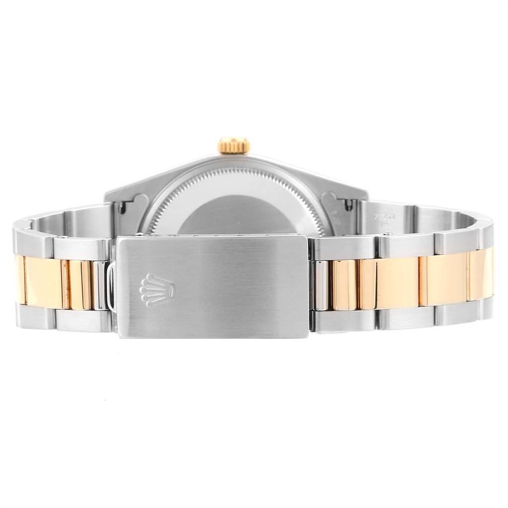 The image shows the backside of a Rolex Oyster Perpetual 14233 Men's Steel and Gold (two tone) Grey Dial 14233 Men's Steel and Gold (two tone) Grey Dial watch, specifically highlighting its clasp and bracelet.
