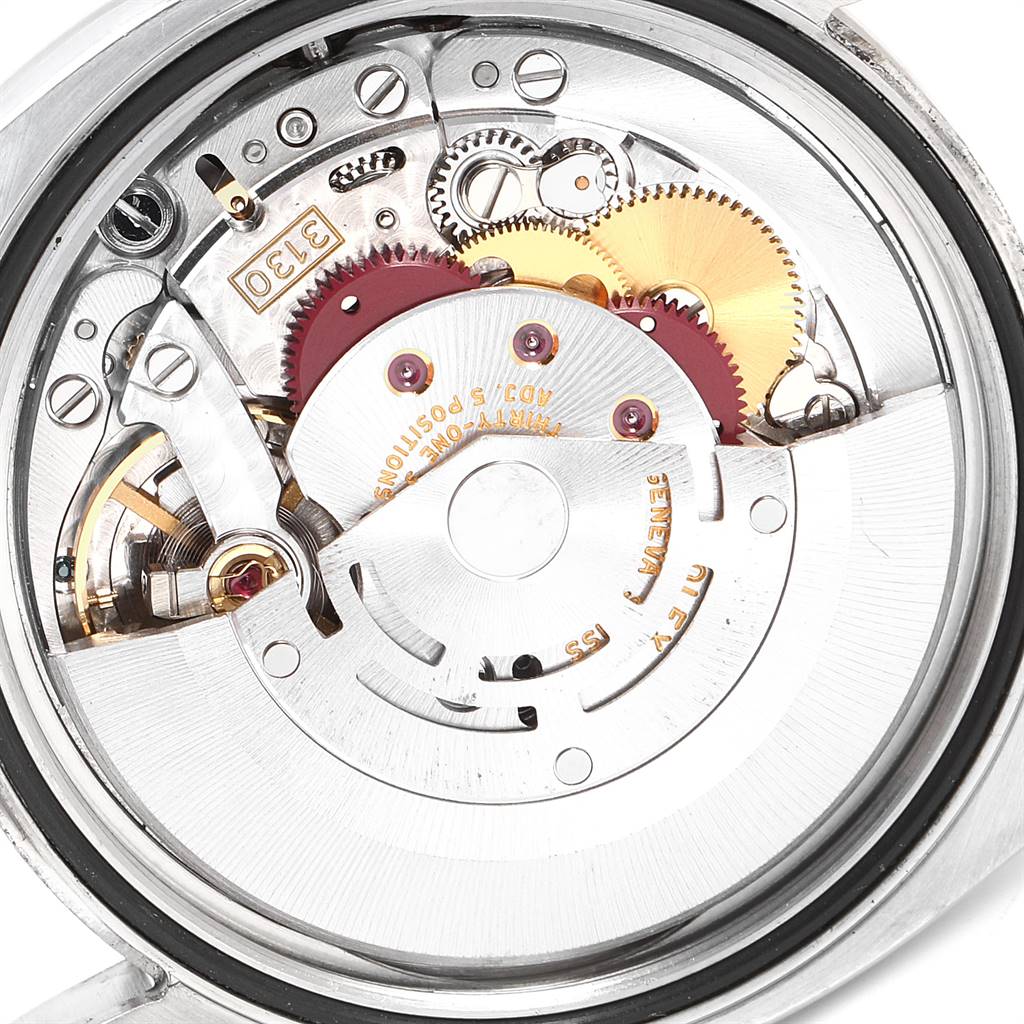This image shows the internal mechanism and gears of a Rolex Oyster Perpetual 116034 Men's Stainless Steel Black Dial 116034 Men's Stainless Steel Black Dial watch from a top-down angle.