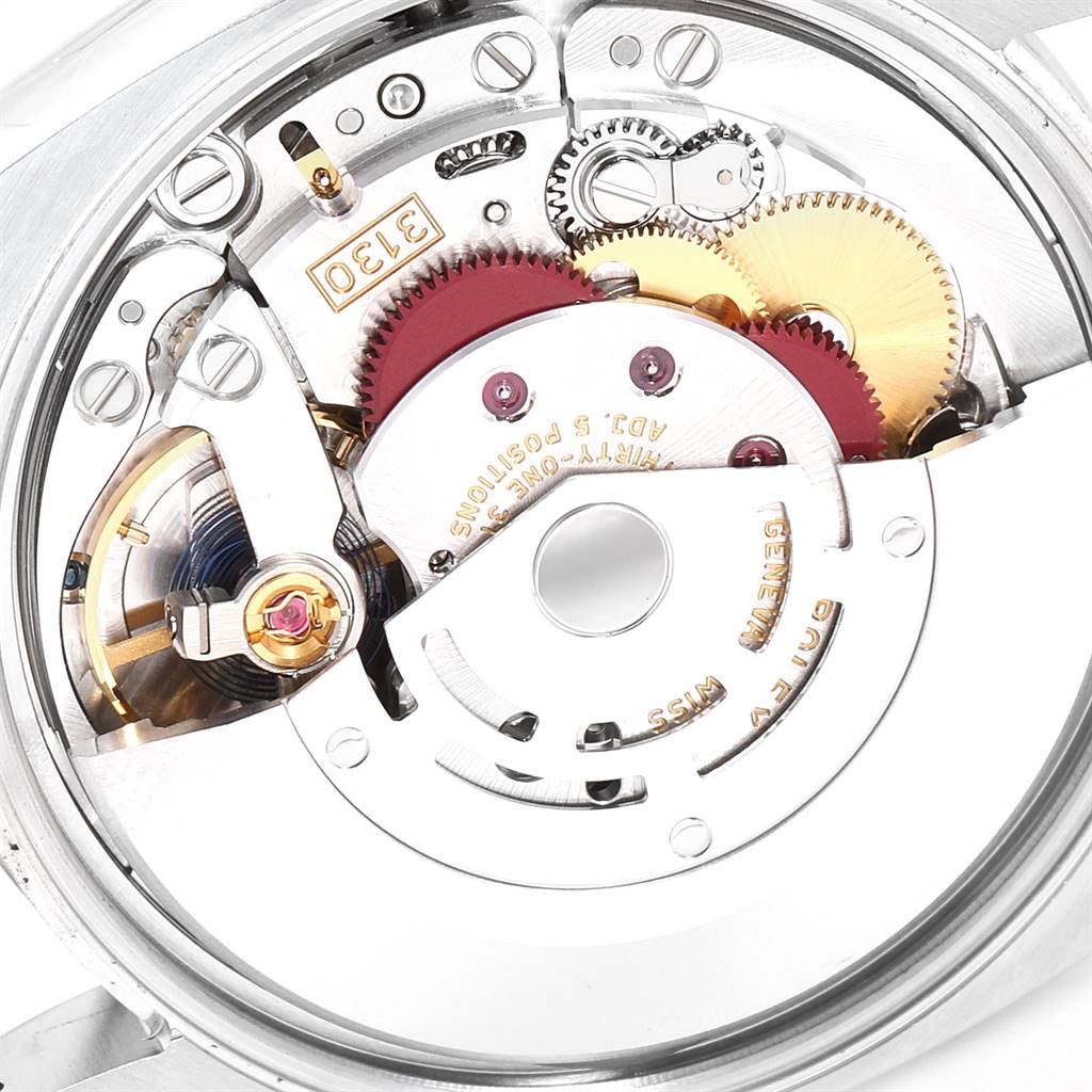 This close-up image shows the intricate internal movement parts of the Rolex Oyster Perpetual 114200 Men
s Stainless Steel Champagne Dial 114200 Men
s Stainless Steel Champagne Dial watch.