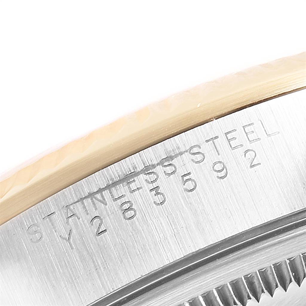The image shows a close-up of the stainless steel casing and engraved serial number of a Rolex Oyster Perpetual 14233 Men's Steel and Gold (two tone) Grey Dial 14233 Men's Steel and Gold (two tone) Grey Dial watch.