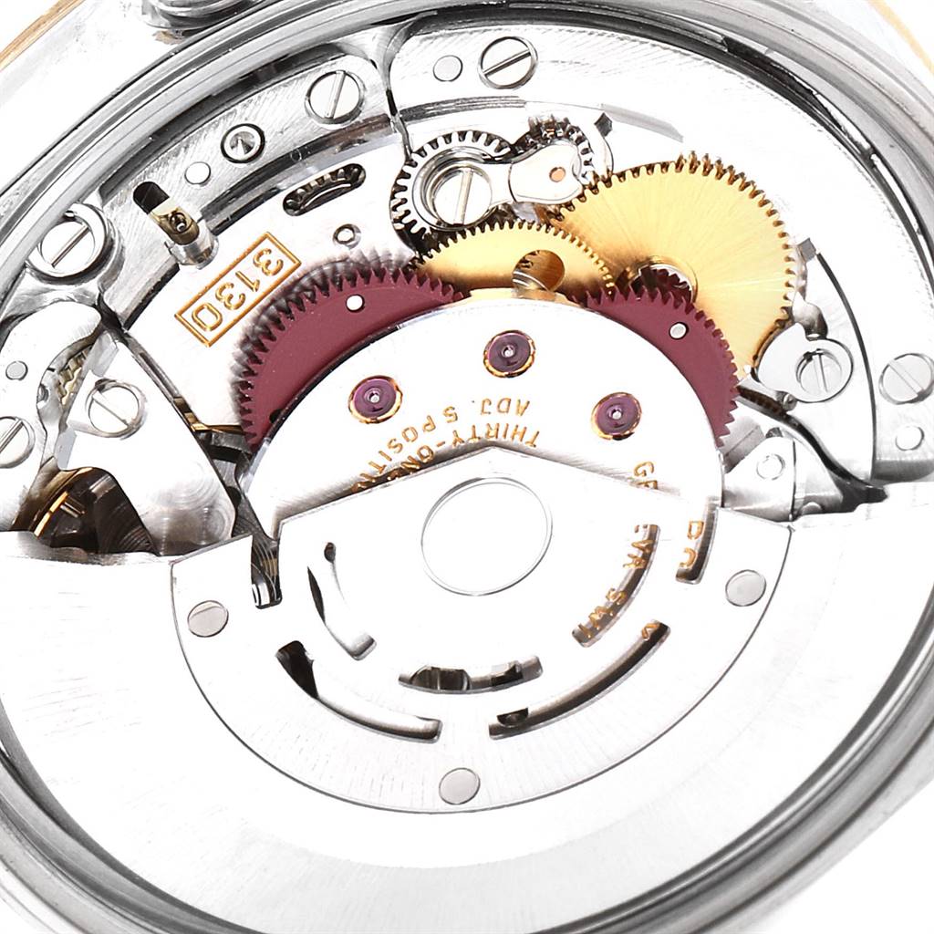 The image shows a close-up of the internal movement mechanism of a Rolex Oyster Perpetual 14233 Men's Steel and Gold (two tone) Grey Dial 14233 Men's Steel and Gold (two tone) Grey Dial watch.