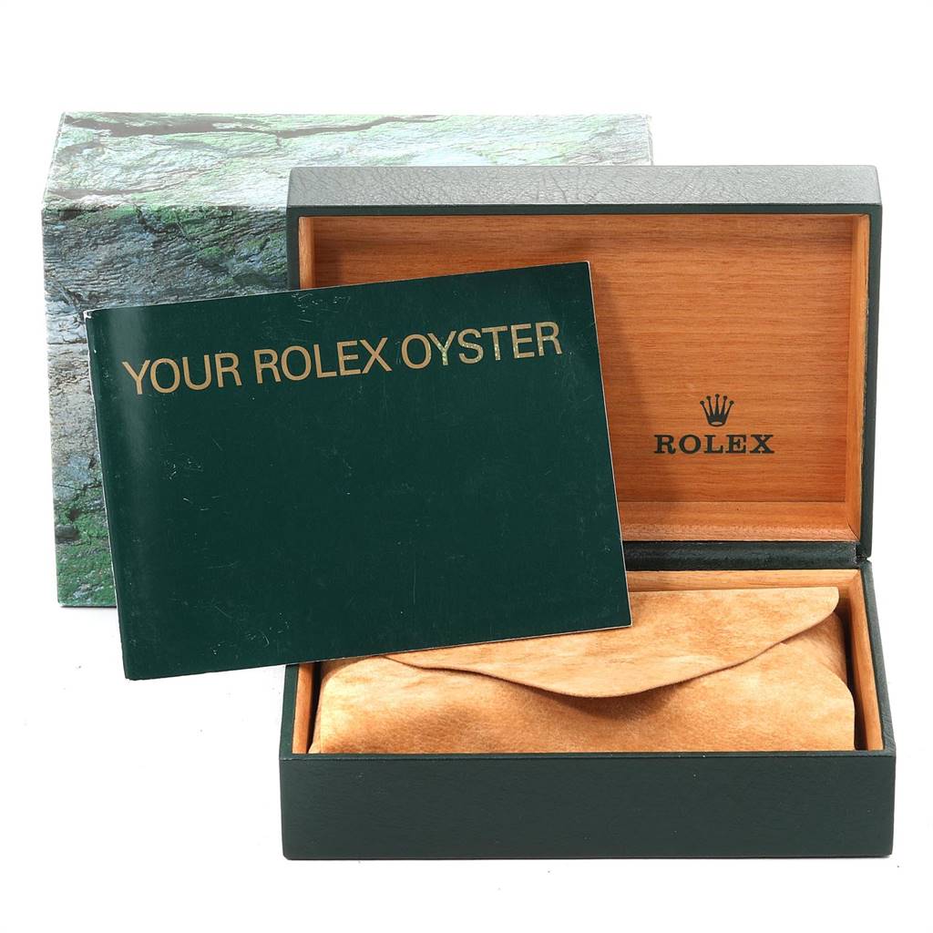 This image shows the open box and manual of the Rolex Oyster Perpetual 14233 Men's Steel and Gold (two tone) Grey Dial 14233 Men's Steel and Gold (two tone) Grey Dial watch.