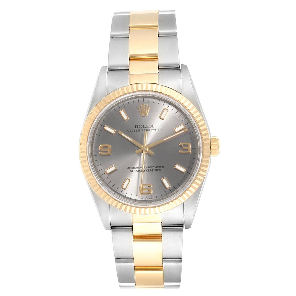 The image shows a Rolex Oyster Perpetual 14233 Men's Steel and Gold (two tone) Grey Dial 14233 Men's Steel and Gold (two tone) Grey Dial watch from a front view, highlighting its face, bezel, and two-tone bracelet.
