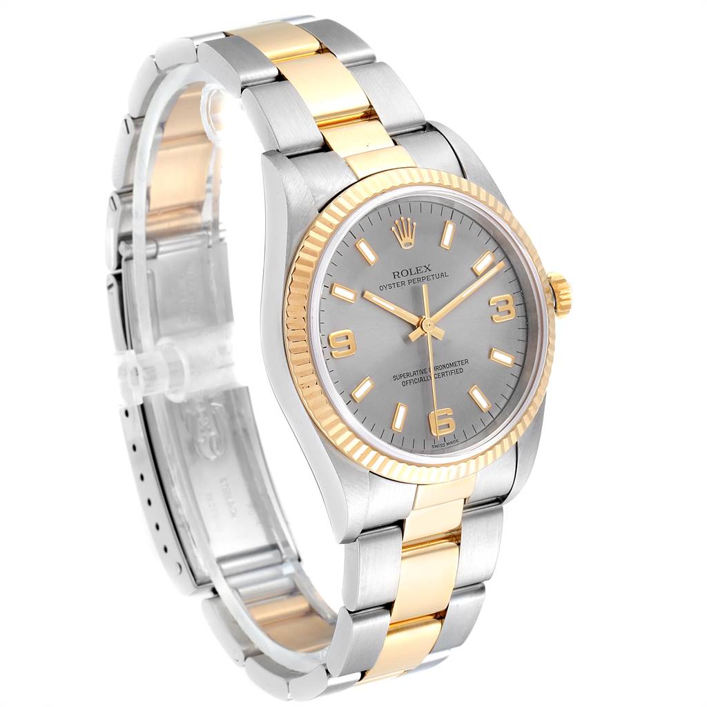 The Rolex Oyster Perpetual 14233 Men's Steel and Gold (two tone) Grey Dial 14233 Men's Steel and Gold (two tone) Grey Dial watch is shown at a slight angle, highlighting its two-tone metal bracelet, dial, and fluted bezel.