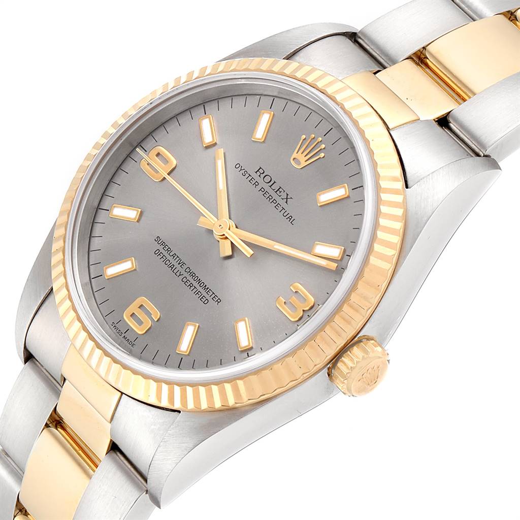 The Rolex Oyster Perpetual 14233 Men's Steel and Gold (two tone) Grey Dial 14233 Men's Steel and Gold (two tone) Grey Dial watch is shown at an oblique angle, highlighting the bezel, bracelet, and crown.