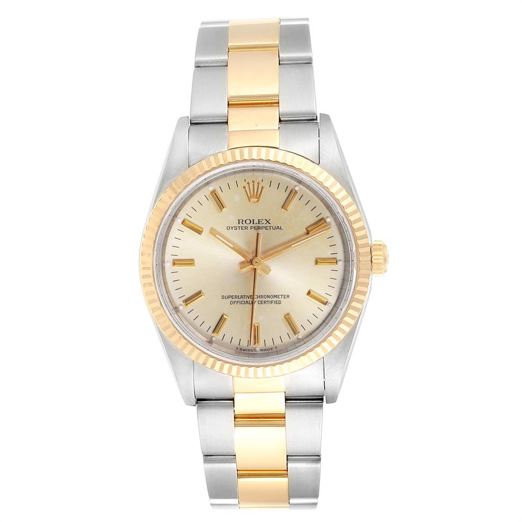 The image shows a front view of a Rolex Oyster Perpetual 14233 Men's Steel and Gold (two tone) Silver Dial 14233 Men's Steel and Gold (two tone) Silver Dial watch, highlighting its two-tone bracelet and gold fluted bezel.