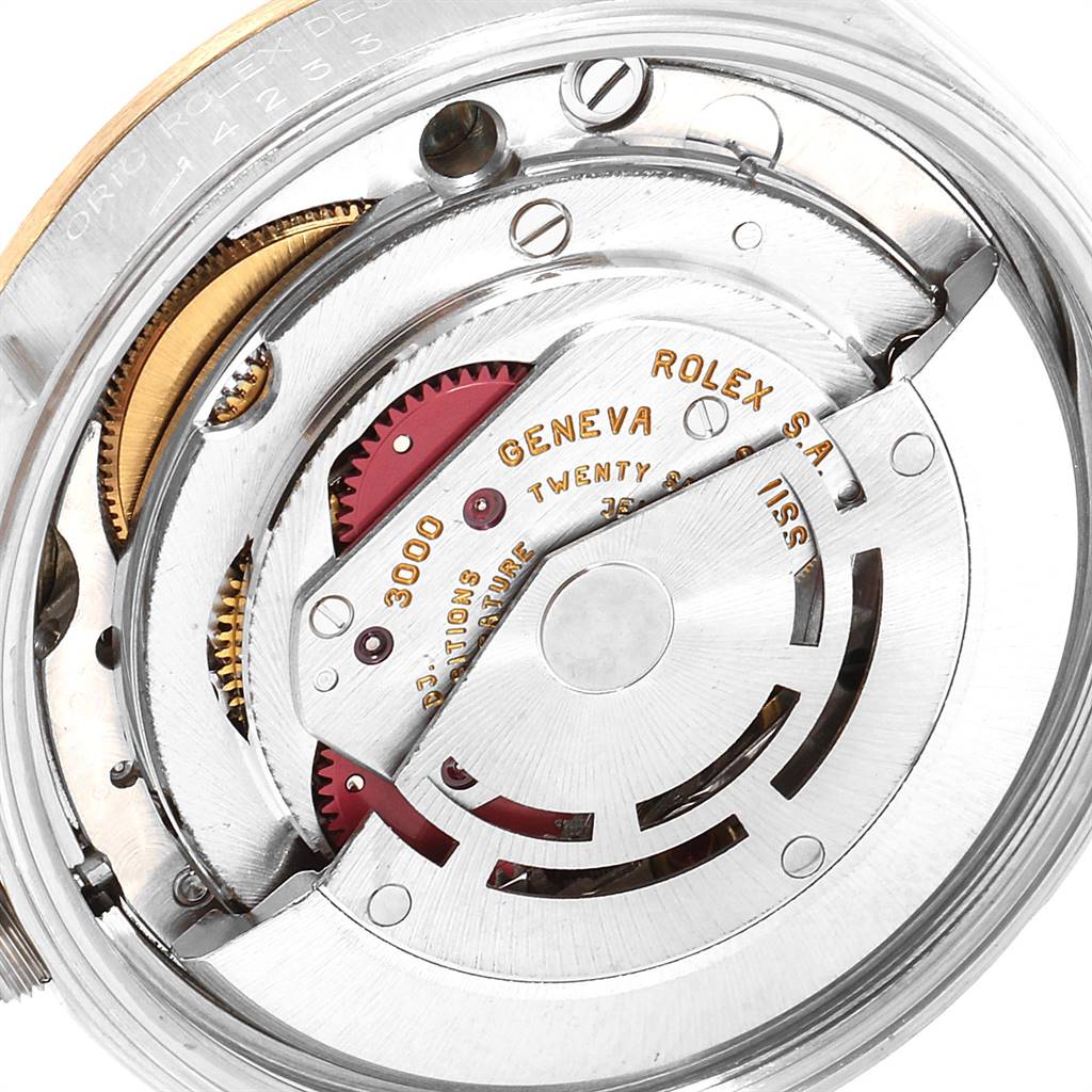 The image shows a close-up of the movement and internal parts of a Rolex Oyster Perpetual 14233 Men's Steel and Gold (two tone) Grey Dial 14233 Men's Steel and Gold (two tone) Grey Dial watch.