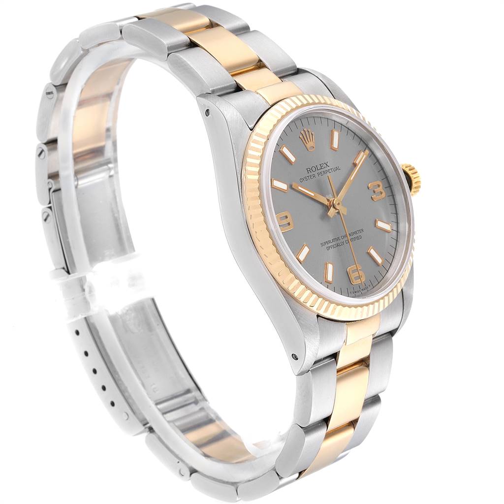 This image shows an angled view of a Rolex Oyster Perpetual 14233 Men's Steel and Gold (two tone) Grey Dial 14233 Men's Steel and Gold (two tone) Grey Dial watch, highlighting its bezel, face, and bracelet.