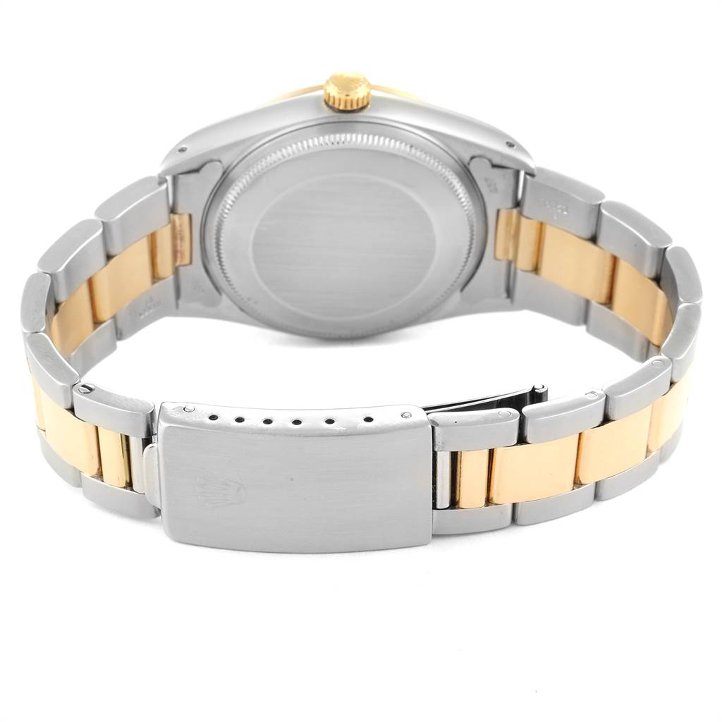 This image shows the back case and bracelet of a Rolex Oyster Perpetual 14233 Men's Steel and Gold (two tone) Grey Dial 14233 Men's Steel and Gold (two tone) Grey Dial watch, with a combination of stainless steel and gold links.