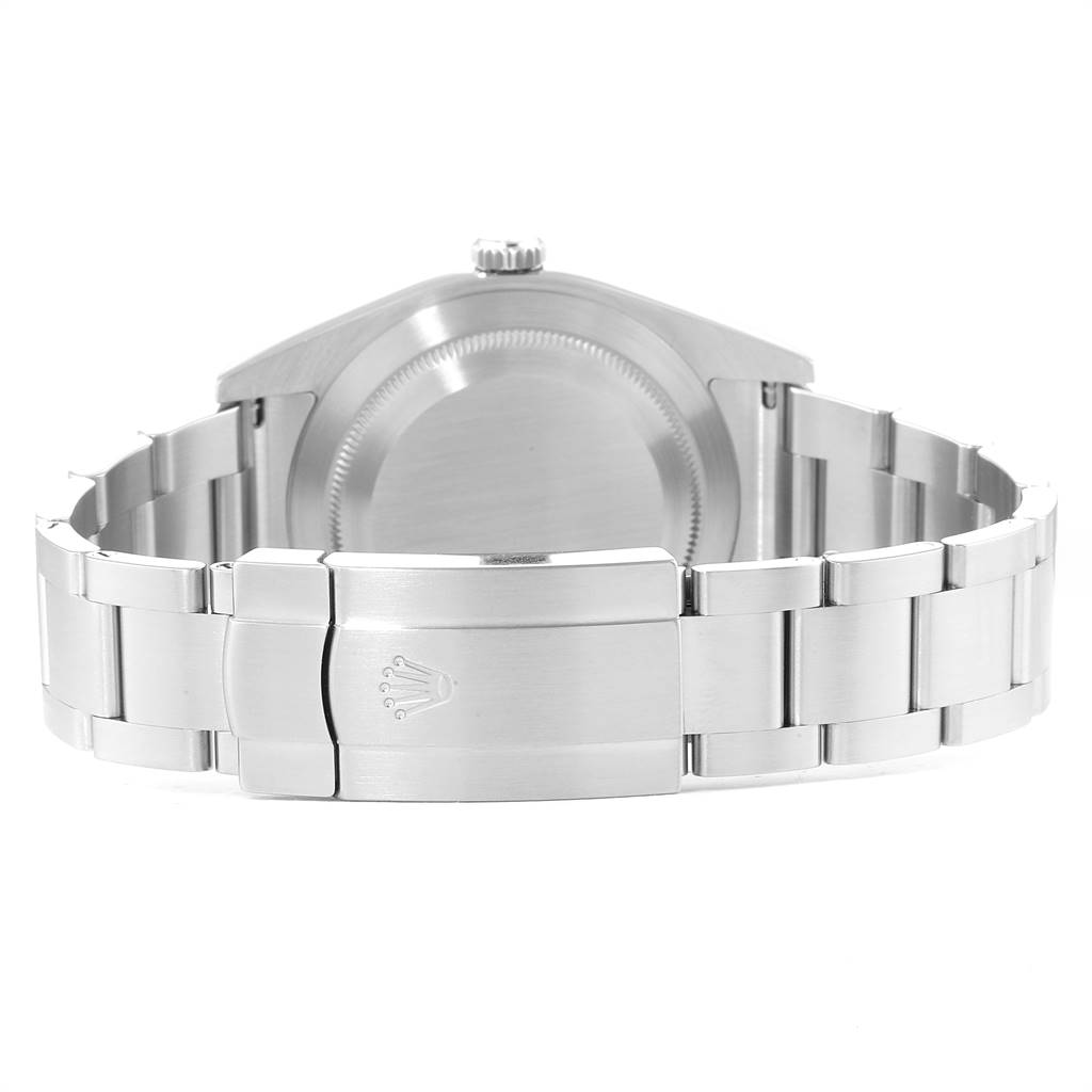 The image shows the back view of a Rolex Oyster Perpetual 114300 Men's Stainless Steel Silver Dial 114300 Men's Stainless Steel Silver Dial watch, focusing on the closed clasp and the case back.