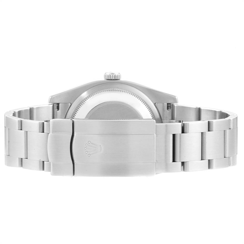 This view of the Rolex Oyster Perpetual 116034 Men
s Stainless Steel Black Dial 116034 Men
s Stainless Steel Black Dial watch shows the back case and the closed metal bracelet clasp.