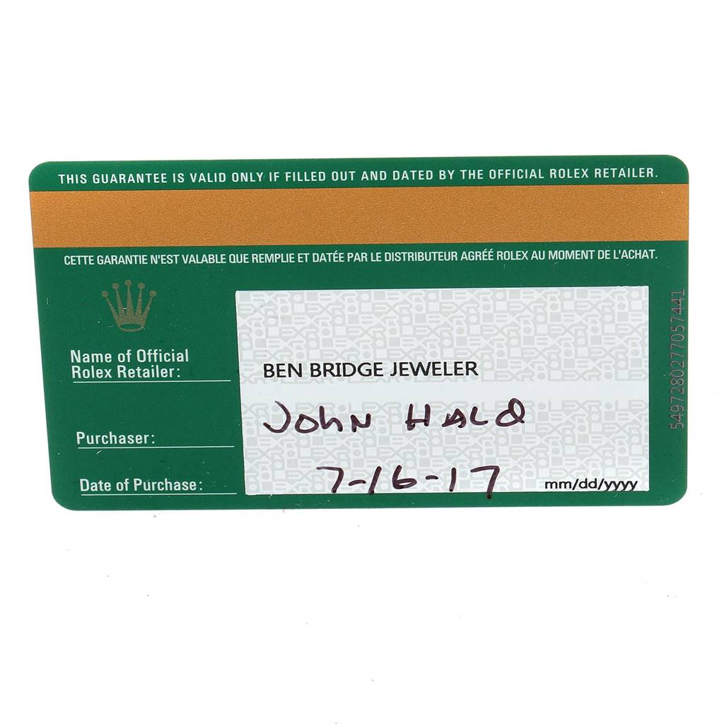 This image shows the warranty card for a Rolex Oyster Perpetual 114300 Men
s Stainless Steel Burgundy Dial 114300 Men
s Stainless Steel Burgundy Dial watch from a flat angle.