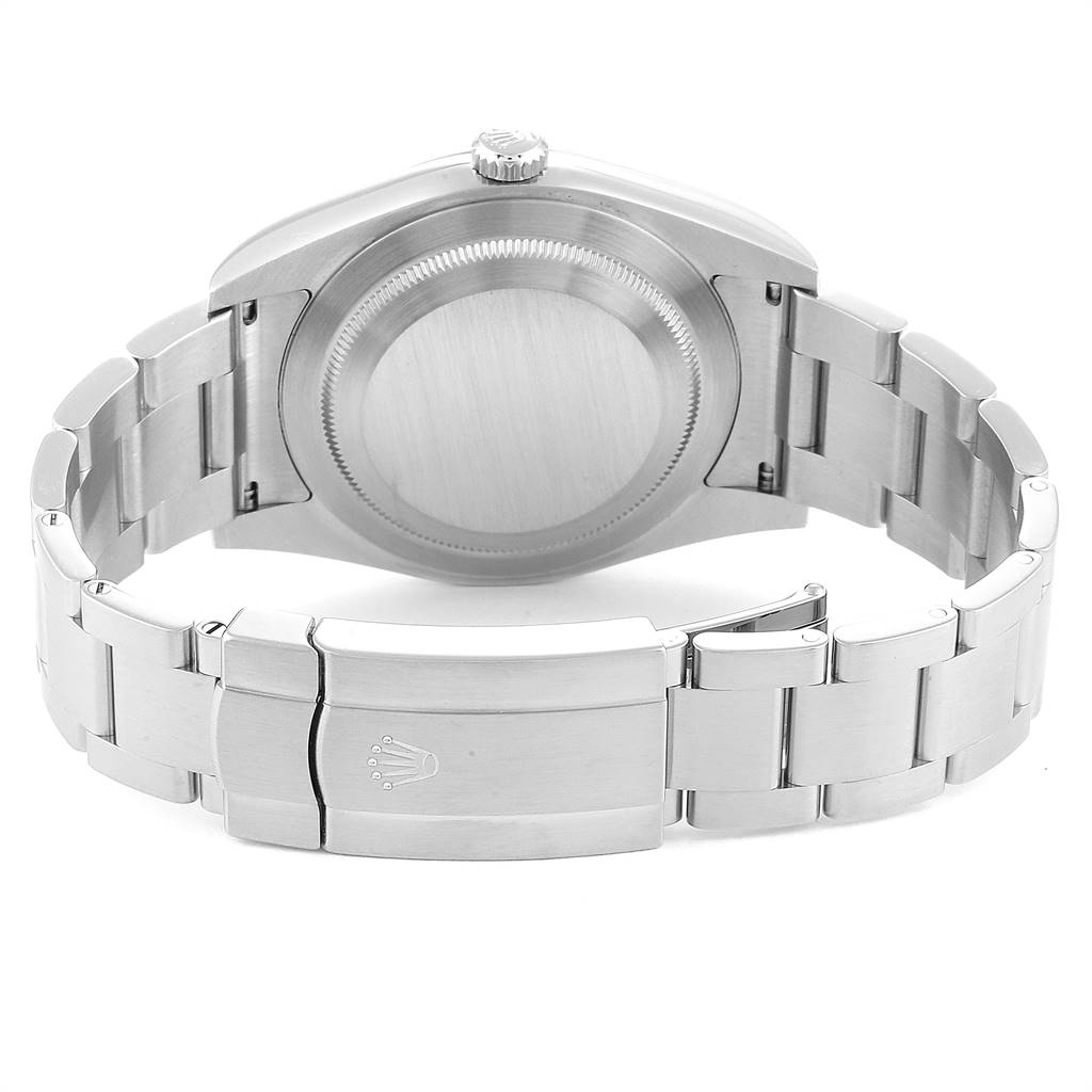 The image shows the backside of a Rolex Oyster Perpetual 114300 Men
s Stainless Steel Burgundy Dial 114300 Men
s Stainless Steel Burgundy Dial watch, highlighting the closed clasp and case back.