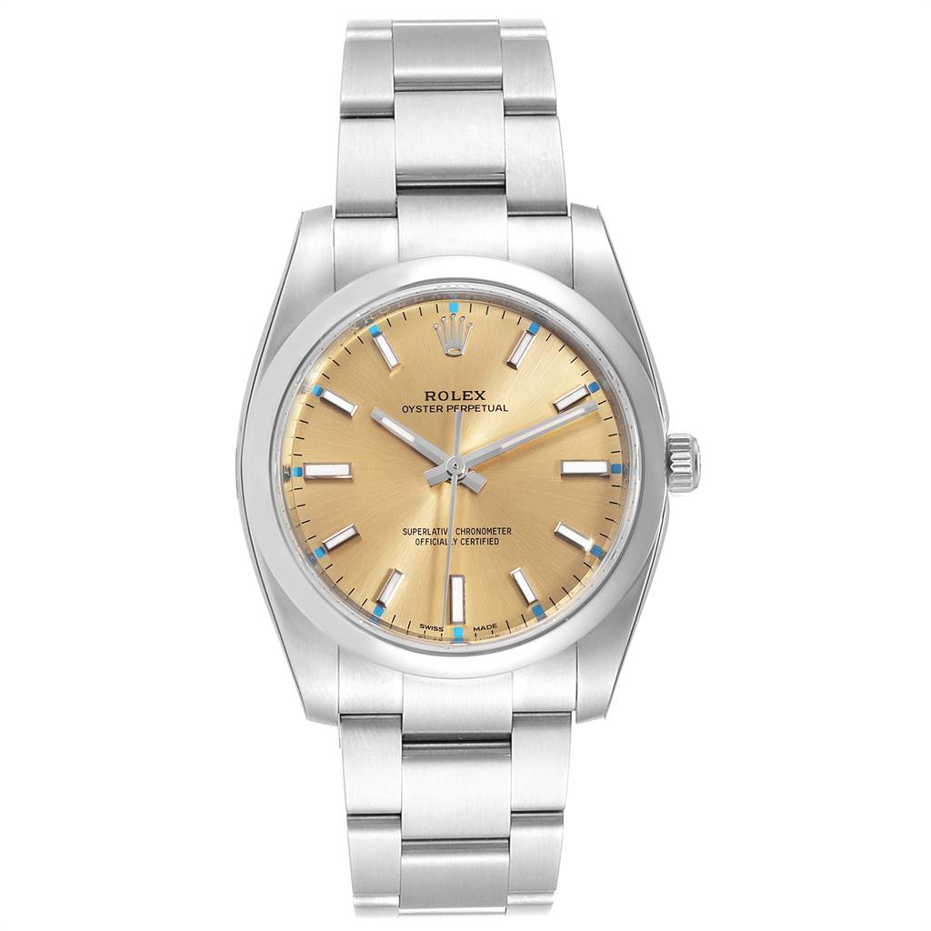 The image shows a Rolex Oyster Perpetual 114200 Men
s Stainless Steel Champagne Dial 114200 Men
s Stainless Steel Champagne Dial watch, photographed from the front, featuring its dial, bezel, and bracelet.