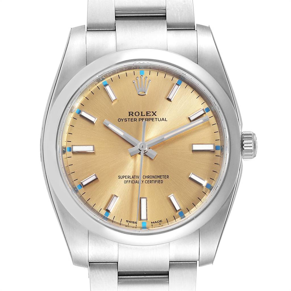 This image shows a frontal view of the Rolex Oyster Perpetual 114200 Men
s Stainless Steel Champagne Dial 114200 Men
s Stainless Steel Champagne Dial watch, highlighting the dial, bezel, and part of the bracelet.