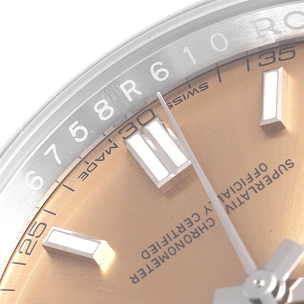 The image shows a close-up angle of the dial and bezel of a Rolex Oyster Perpetual 116000 Men's Stainless Steel Champagne Dial 116000 Men's Stainless Steel Champagne Dial watch.
