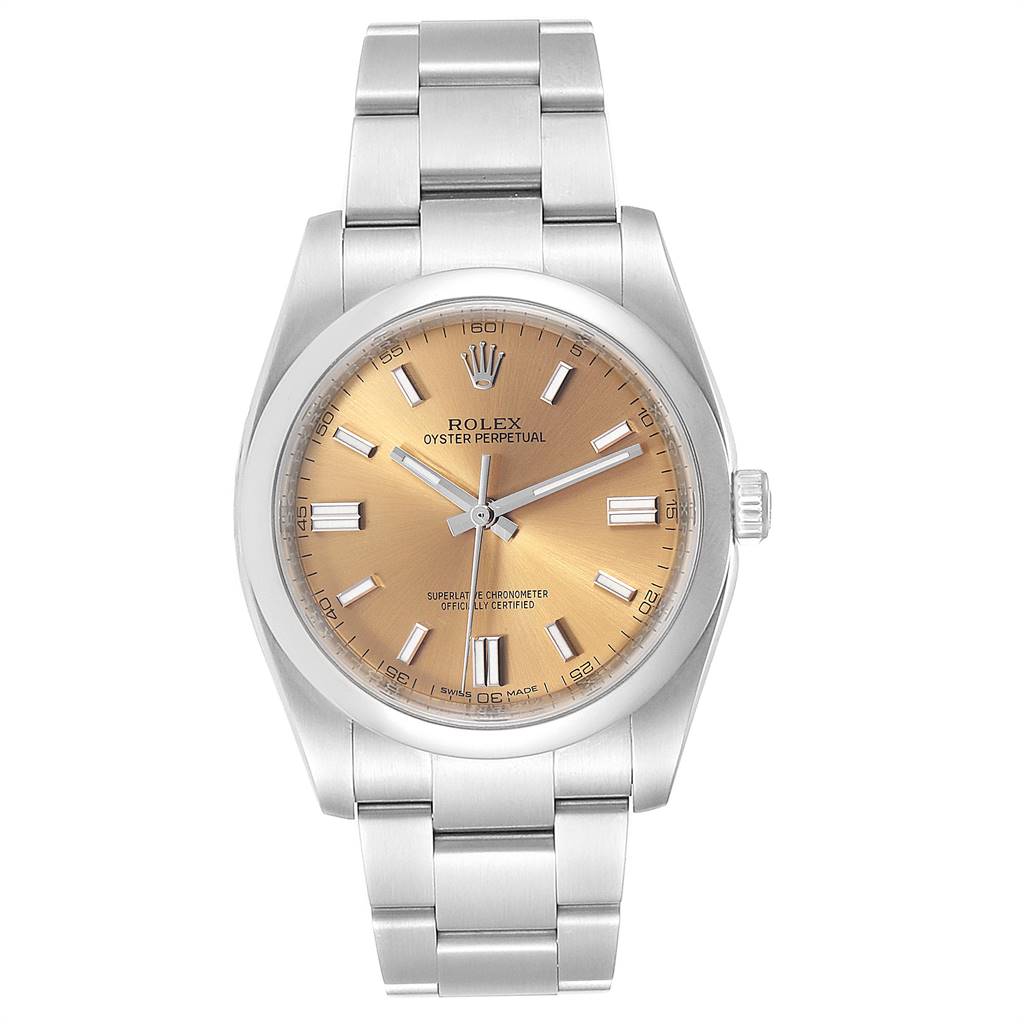 The image shows a frontal view of a Rolex Oyster Perpetual 116000 Men's Stainless Steel Champagne Dial 116000 Men's Stainless Steel Champagne Dial watch, featuring its dial, case, and bracelet.