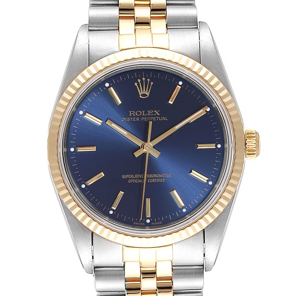 The image shows a front view of the Rolex Oyster Perpetual 14233 Men's Steel and Gold (two tone) Blue Dial 14233 Men's Steel and Gold (two tone) Blue Dial watch, highlighting the blue dial and the two-tone bracelet and bezel.