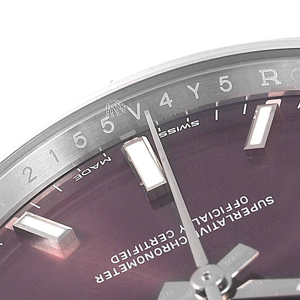 This image shows a close-up angle of the dial and bezel of the Rolex Oyster Perpetual 114200 Men's Stainless Steel Burgundy Dial 114200 Men's Stainless Steel Burgundy Dial watch, highlighting the hour markers and text on the face.