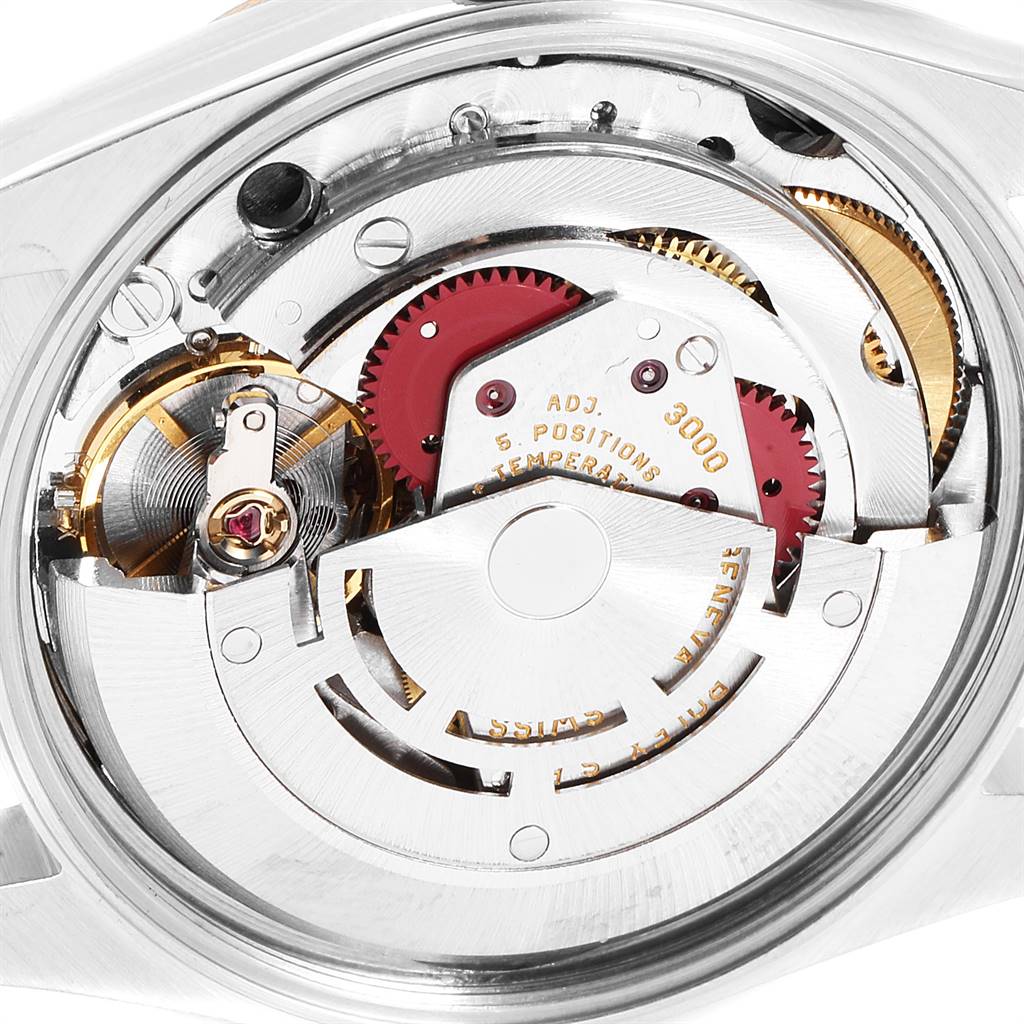 The image shows the internal mechanism of a Rolex Oyster Perpetual 14233 Men
s Steel and Gold (two tone) White Dial 14233 Men
s Steel and Gold (two tone) White Dial watch, viewed from the back.