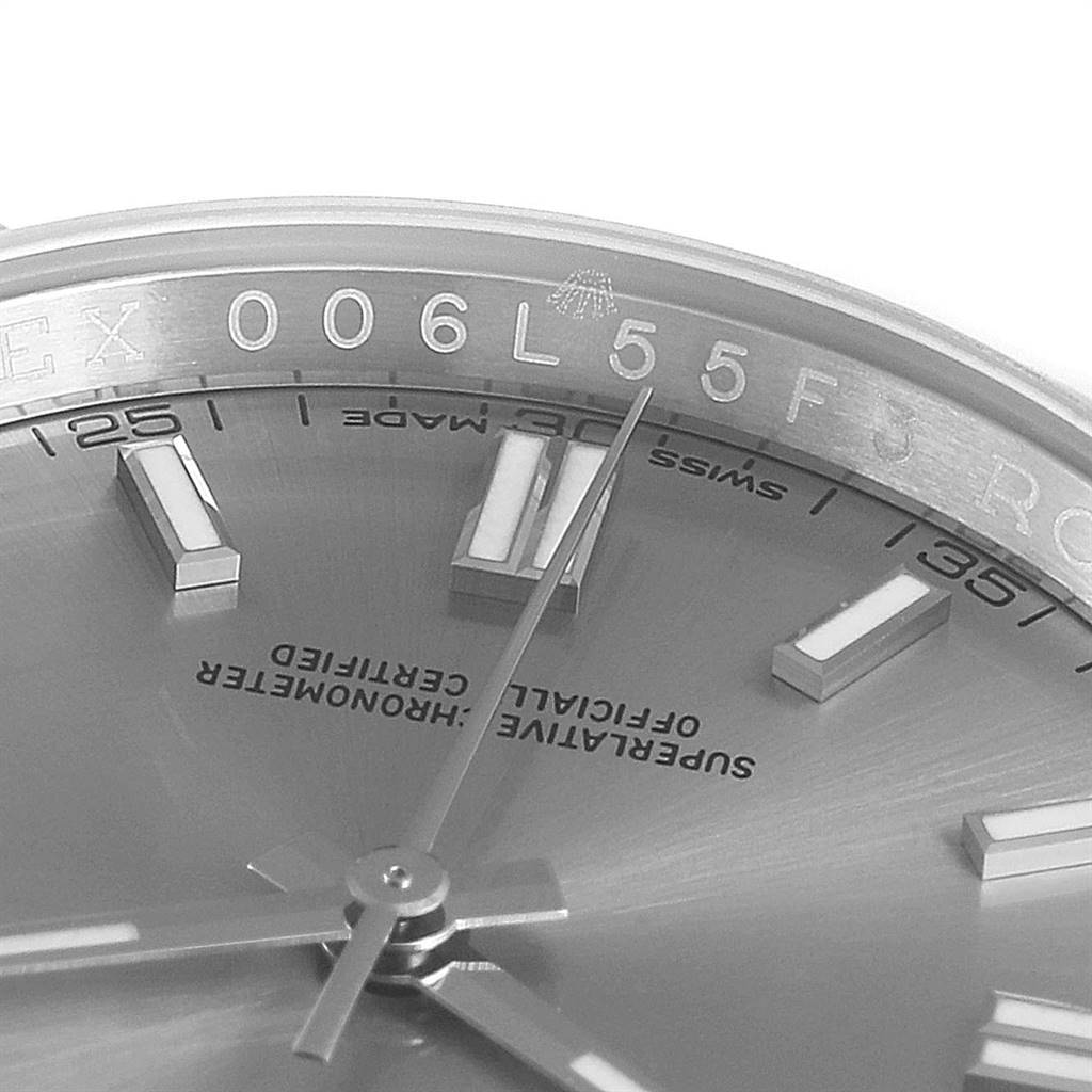 This image shows a close-up angle of the dial and bezel parts of a Rolex Oyster Perpetual 116000 Men's Stainless Steel Grey Dial 116000 Men's Stainless Steel Grey Dial watch.