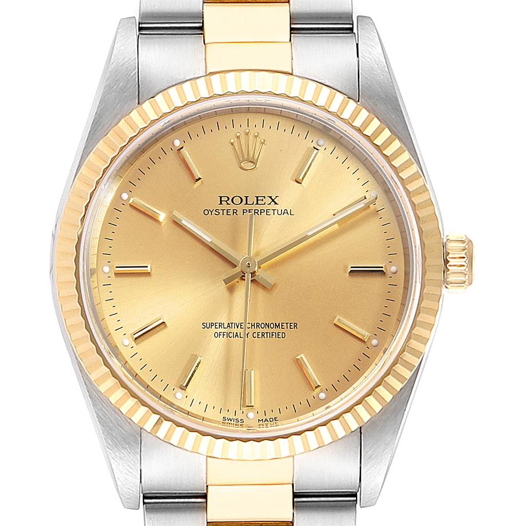 The image shows a close-up, frontal view of the Rolex Oyster Perpetual 14233 Men
s Steel and Gold (two tone) Champagne Dial 14233 Men
s Steel and Gold (two tone) Champagne Dial watch, highlighting the gold dial, bezel, and part of the bracelet.
