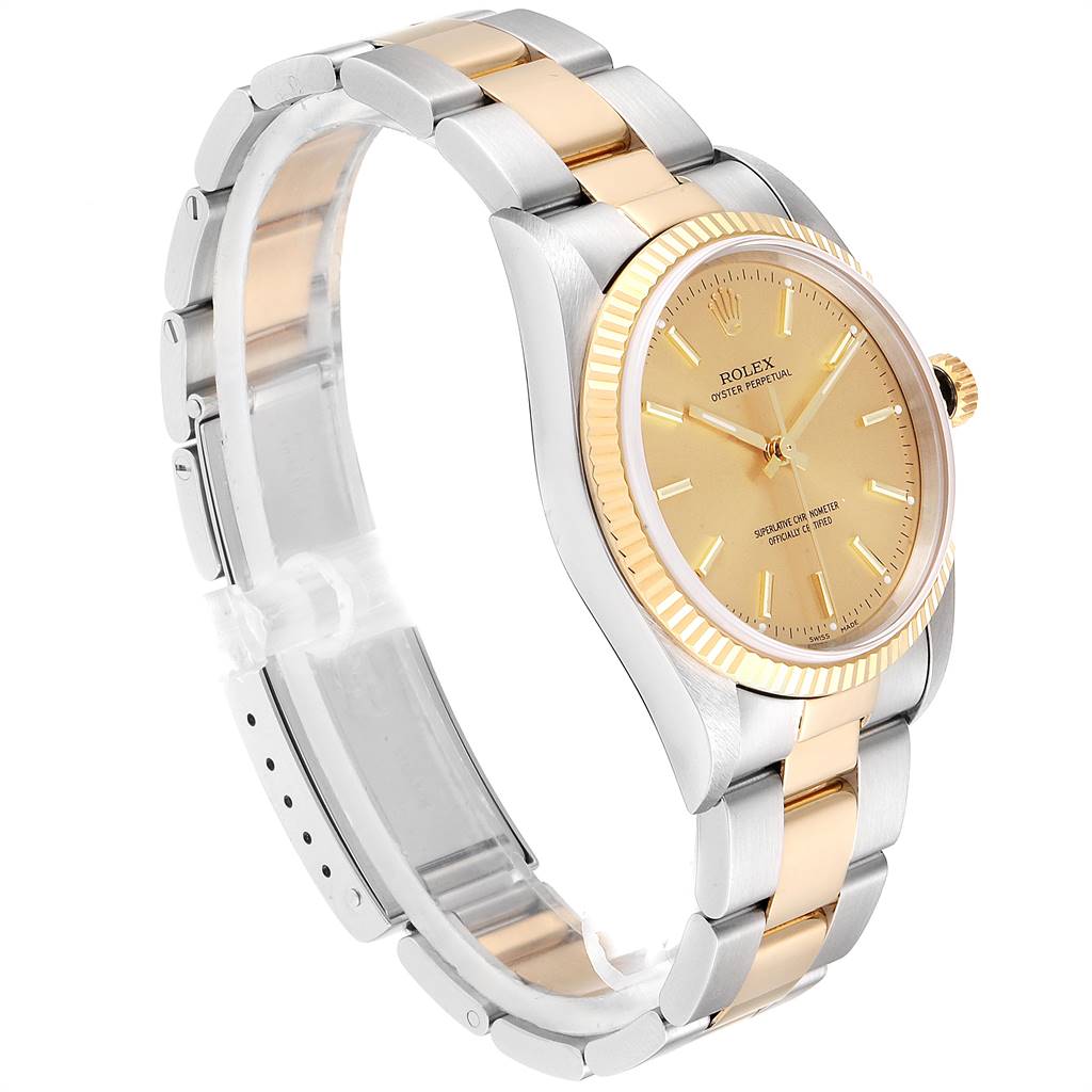This Rolex Oyster Perpetual 14233 Men
s Steel and Gold (two tone) Champagne Dial 14233 Men
s Steel and Gold (two tone) Champagne Dial watch is pictured at a slight angle, showcasing the two-tone bracelet, gold bezel, and dial.