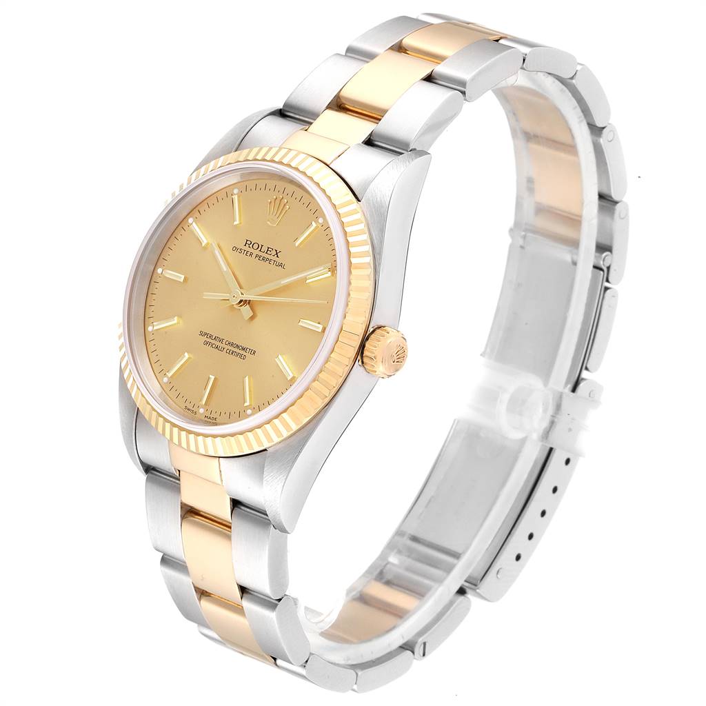 The image shows a Rolex Oyster Perpetual 14233 Men
s Steel and Gold (two tone) Champagne Dial 14233 Men
s Steel and Gold (two tone) Champagne Dial watch at a three-quarter angle, highlighting its gold dial, bezel, and two-tone bracelet.