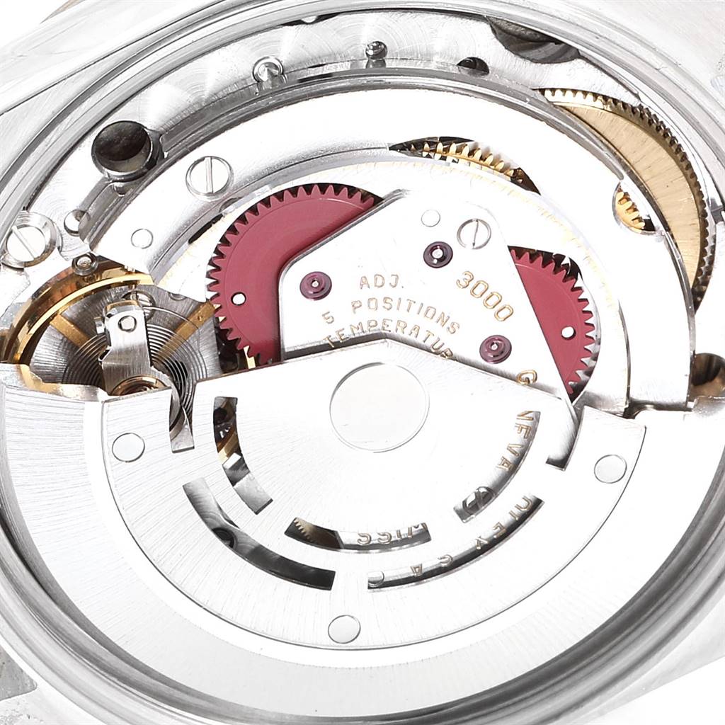 This image shows the inner mechanical movement of the Rolex Oyster Perpetual 14233 Men
s Steel and Gold (two tone) Champagne Dial 14233 Men
s Steel and Gold (two tone) Champagne Dial watch from a close-up angle.