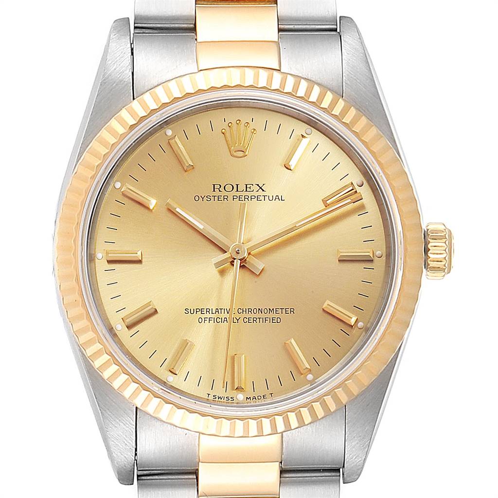 This image shows a front view of a Rolex Oyster Perpetual 14233 Men
s Steel and Gold (two tone) Champagne Dial 14233 Men
s Steel and Gold (two tone) Champagne Dial watch, highlighting its gold dial, hands, and two-tone bracelet.