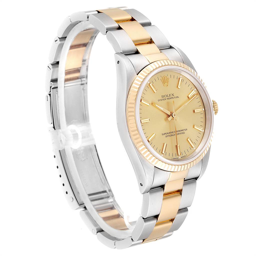 The Rolex Oyster Perpetual 14233 Men
s Steel and Gold (two tone) Champagne Dial 14233 Men
s Steel and Gold (two tone) Champagne Dial watch is displayed at a side angle, showing its gold and silver bracelet and gold dial.
