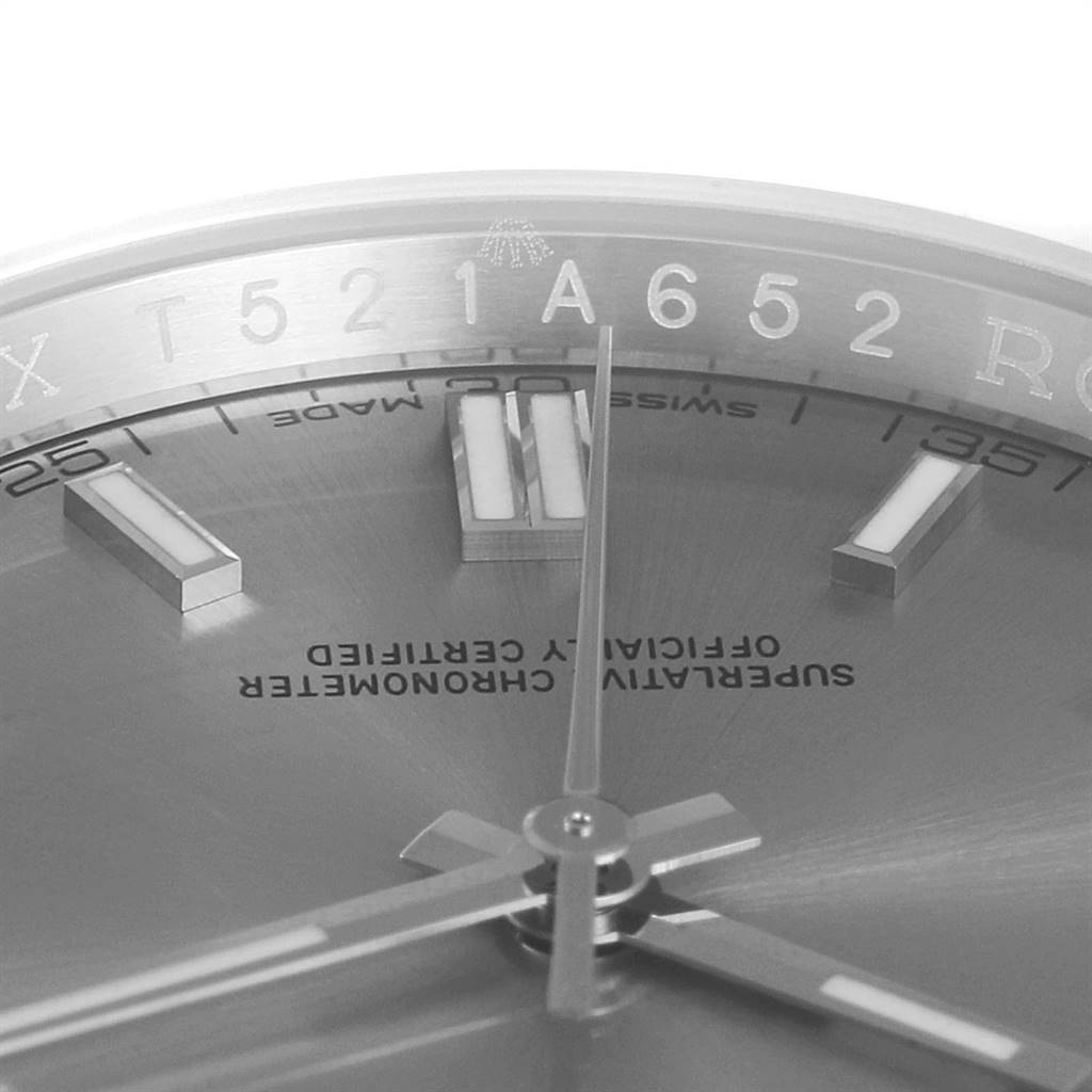 This image shows a close-up angle of the dial, hands, and inner bezel of a Rolex Oyster Perpetual 116000 Men's Stainless Steel Grey Dial 116000 Men's Stainless Steel Grey Dial watch.