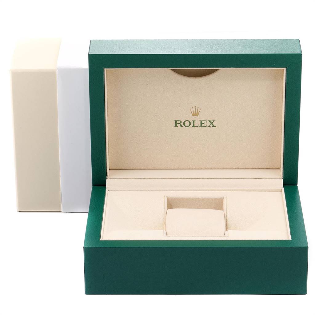 The image shows an open Rolex Oyster Perpetual 116000 Men's Stainless Steel Grey Dial 116000 Men's Stainless Steel Grey Dial watch box with a green exterior and a beige interior.