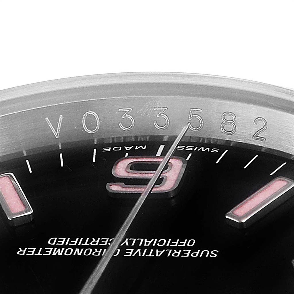 This image shows a close-up of the serial number and dial of the Rolex Oyster Perpetual 116034 Men's Stainless Steel Black Dial 116034 Men's Stainless Steel Black Dial watch.