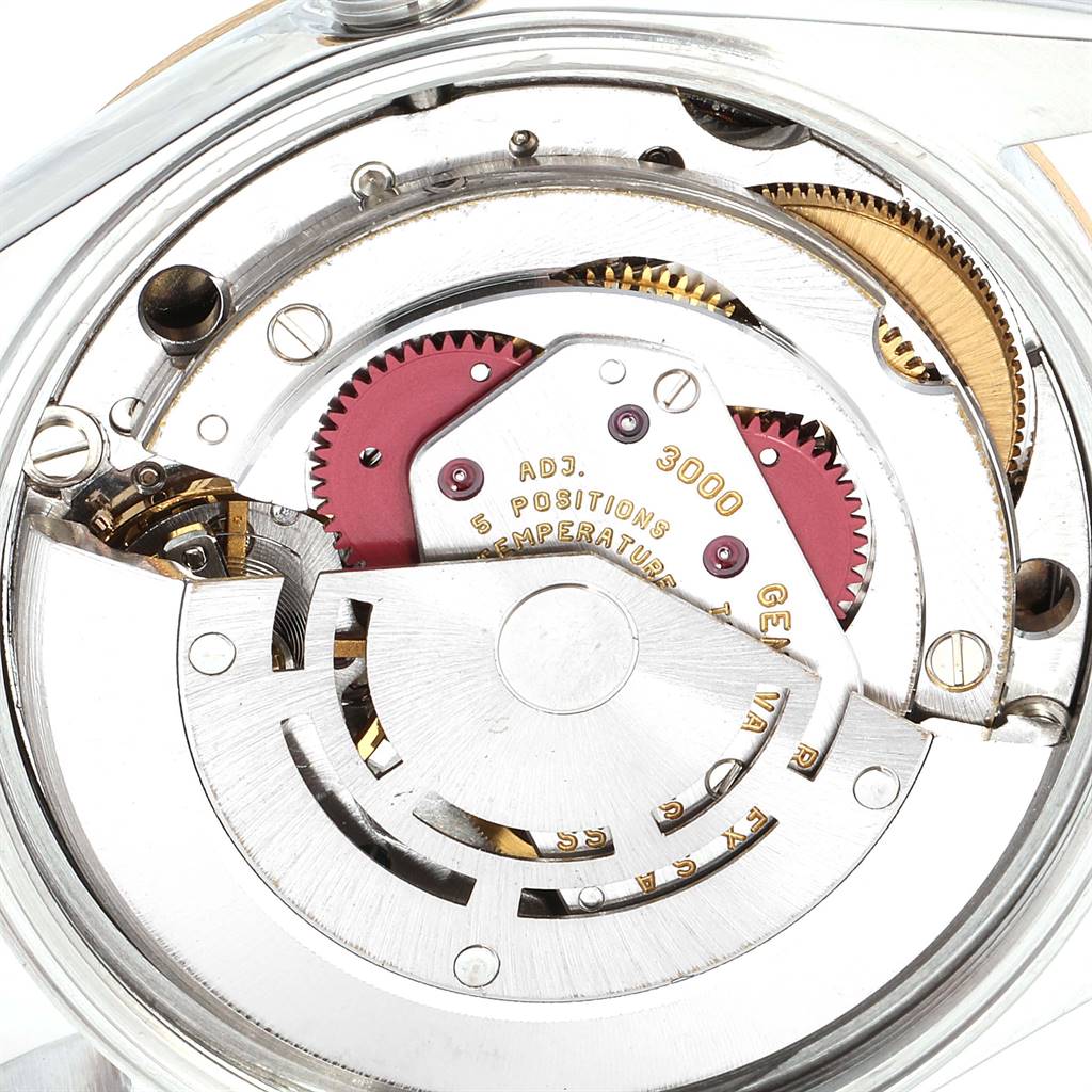 This image shows the inner movement mechanism of the Rolex Oyster Perpetual 14203 Men's Steel and Gold (two tone) Grey Dial 14203 Men's Steel and Gold (two tone) Grey Dial watch from a close-up angle.