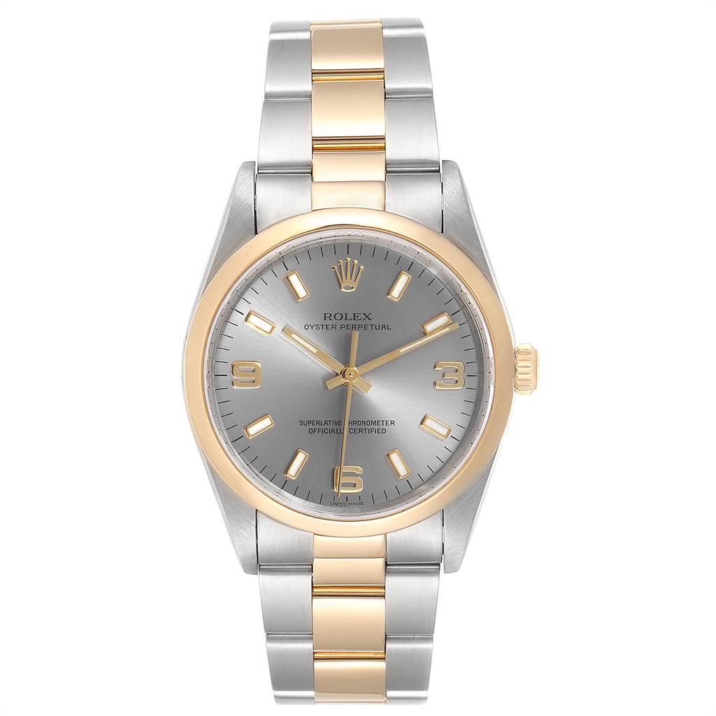 This Rolex Oyster Perpetual 14203 Men's Steel and Gold (two tone) Grey Dial 14203 Men's Steel and Gold (two tone) Grey Dial watch is shown from a front angle, displaying its two-tone bracelet and silver dial with gold markers.
