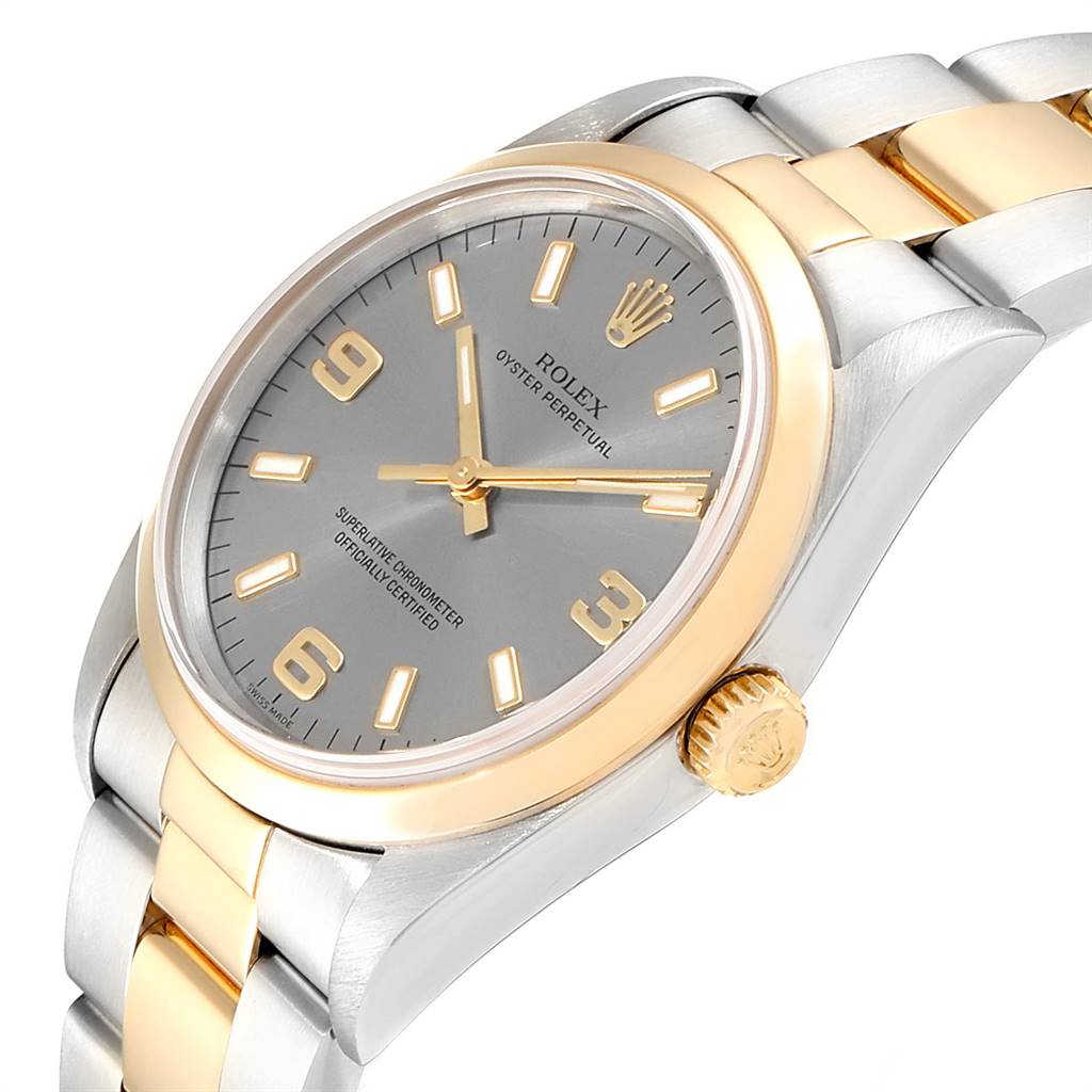 The image shows a side-angle view of the Rolex Oyster Perpetual 14203 Men's Steel and Gold (two tone) Grey Dial 14203 Men's Steel and Gold (two tone) Grey Dial watch, highlighting its bezel, dial, hands, bracelet, and crown.