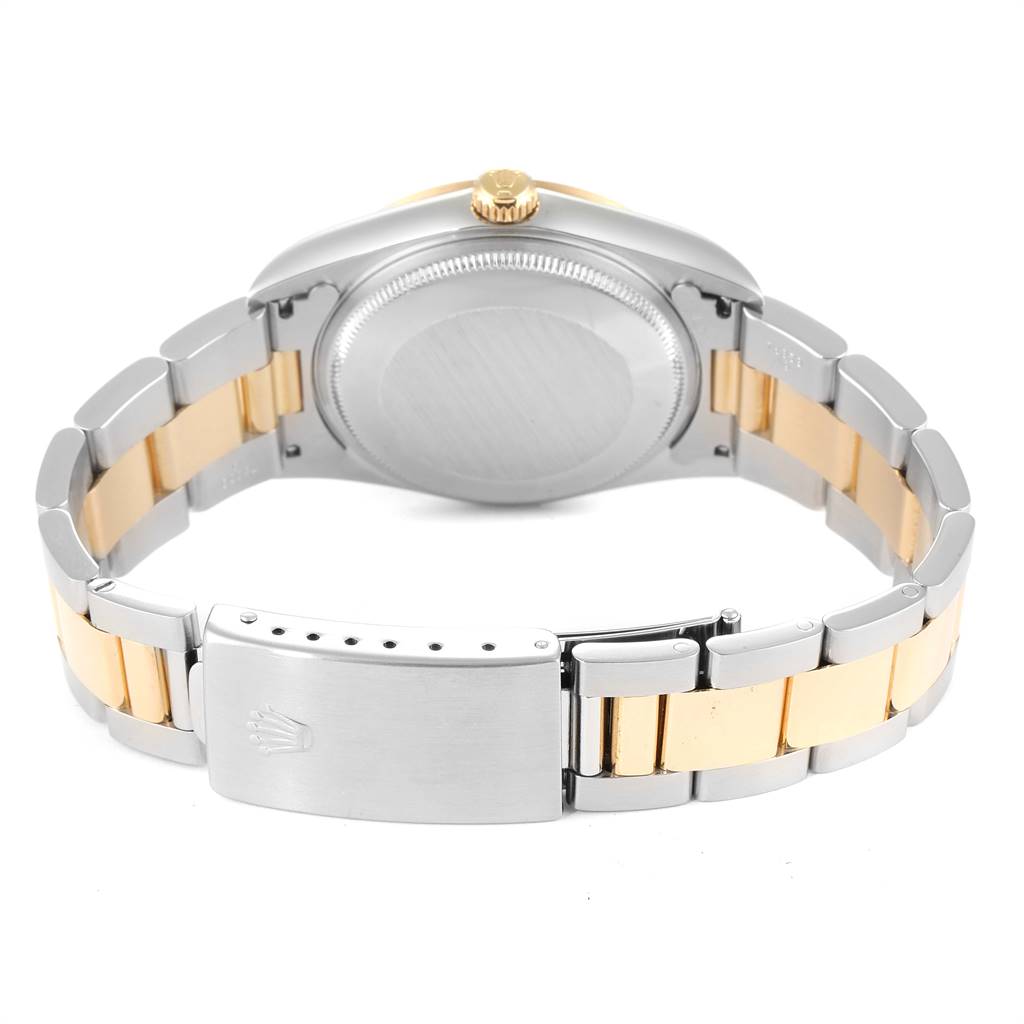 This image shows the back view of a Rolex Oyster Perpetual 14203 Men's Steel and Gold (two tone) Grey Dial 14203 Men's Steel and Gold (two tone) Grey Dial watch, highlighting its case, bracelet, and clasp.