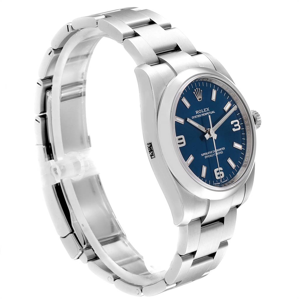 The image shows a side view of a Rolex Oyster Perpetual 114200 Men's Stainless Steel Blue Dial 114200 Men's Stainless Steel Blue Dial watch, highlighting its blue dial and silver bracelet.