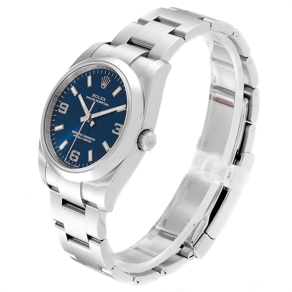 The image shows a side angle of the Rolex Oyster Perpetual 114200 Men's Stainless Steel Blue Dial 114200 Men's Stainless Steel Blue Dial watch, highlighting the face, bezel, crown, and bracelet.