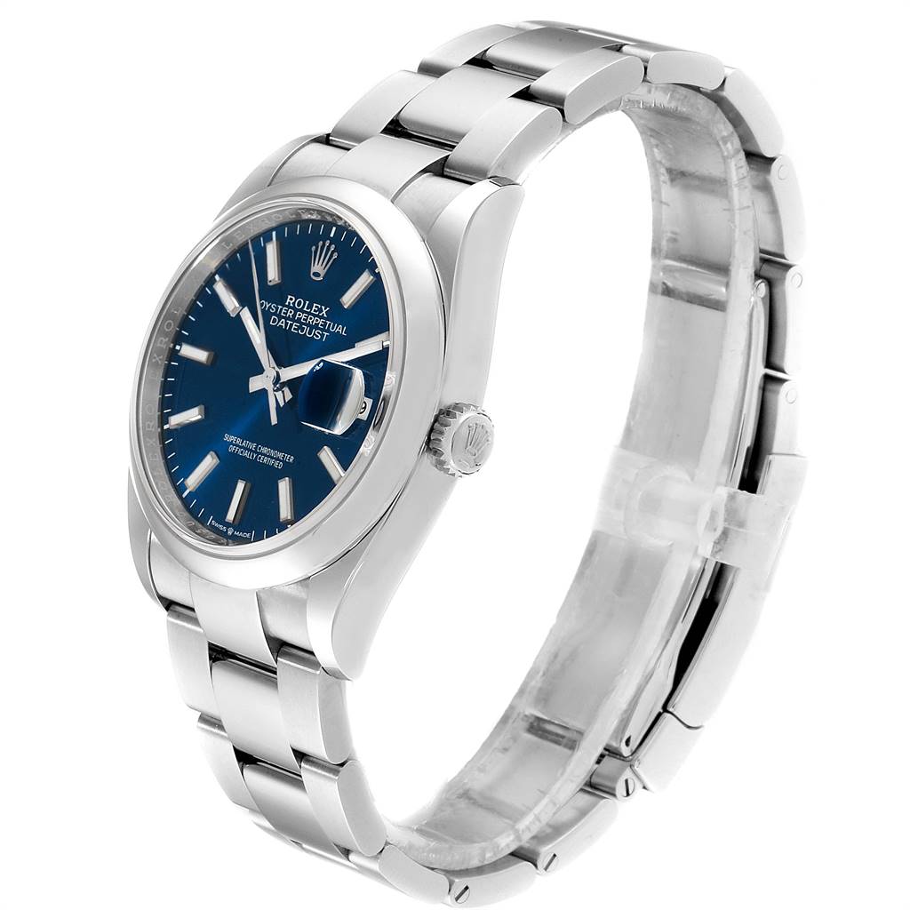The image shows a side and partial front view of the Rolex Datejust 126200 Men's Stainless Steel Blue Dial 126200 Men's Stainless Steel Blue Dial watch, highlighting its blue dial and stainless steel bracelet.