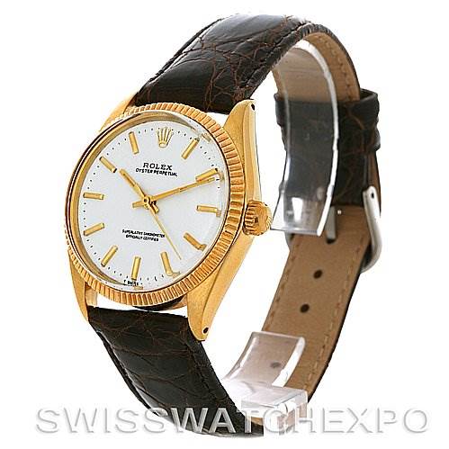 The Rolex Oyster Perpetual Men
s Yellow Gold White Dial Men
s Yellow Gold White Dial watch is shown at a three-quarter angle, displaying its face, case, and leather strap.