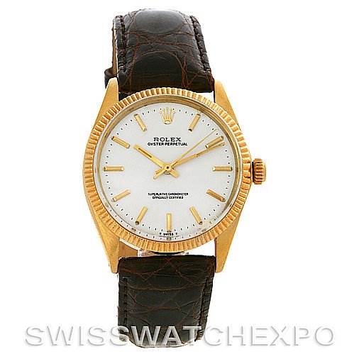 This image shows a front view of a Rolex Oyster Perpetual Men
s Yellow Gold White Dial Men
s Yellow Gold White Dial watch with a white dial, gold bezel, and brown leather strap.